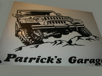 a picture of a jeep on a sign that says patrick's garage