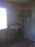 a bathroom with a tiled floor and a window