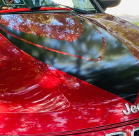 a close up of a red sports car