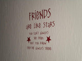 a white wall with a red writing on it that says friends are like stars you