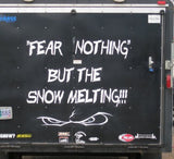 a truck with a message written on the back of it