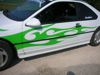 a white and green car with flames painted on it