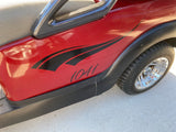 a red golf cart with a black and red decal