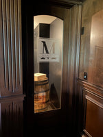 a wooden barrel sitting in front of a mirror